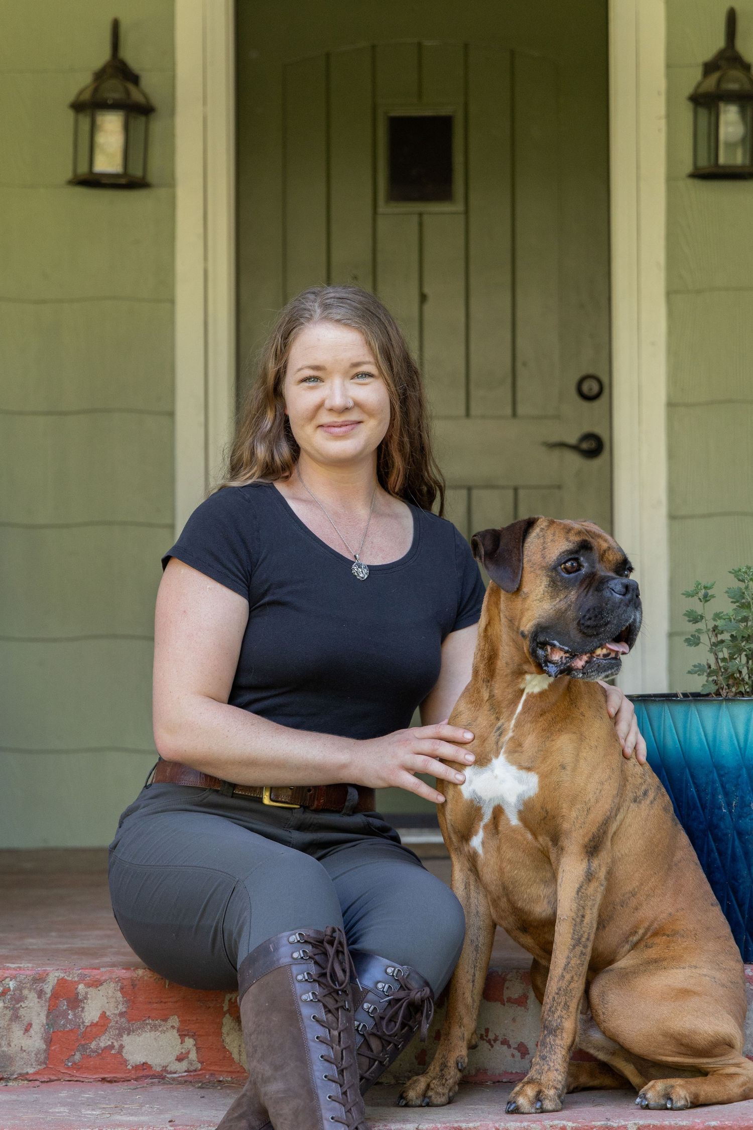 A woman smiling with her dog