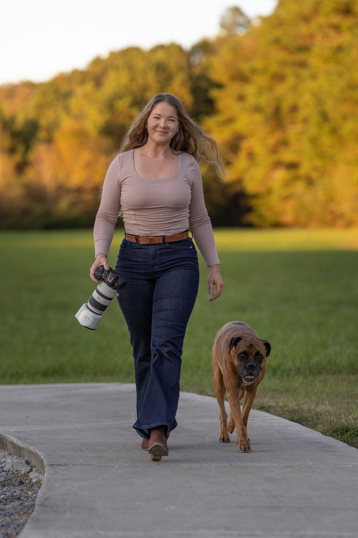 A woman smiling with her dog
