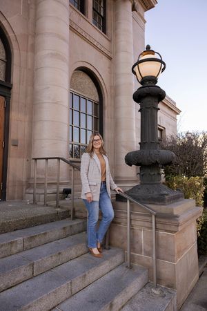 A series of photos showing a person in a beige cardigan and denim skirt posing on stone steps of a classic building.