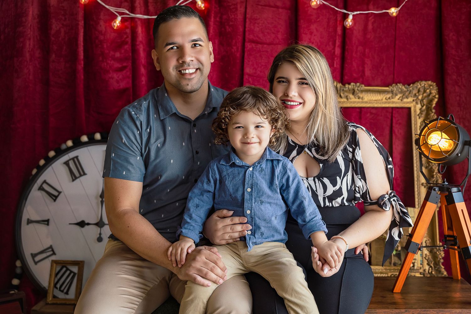 family of three poses with their little boy for profesional images