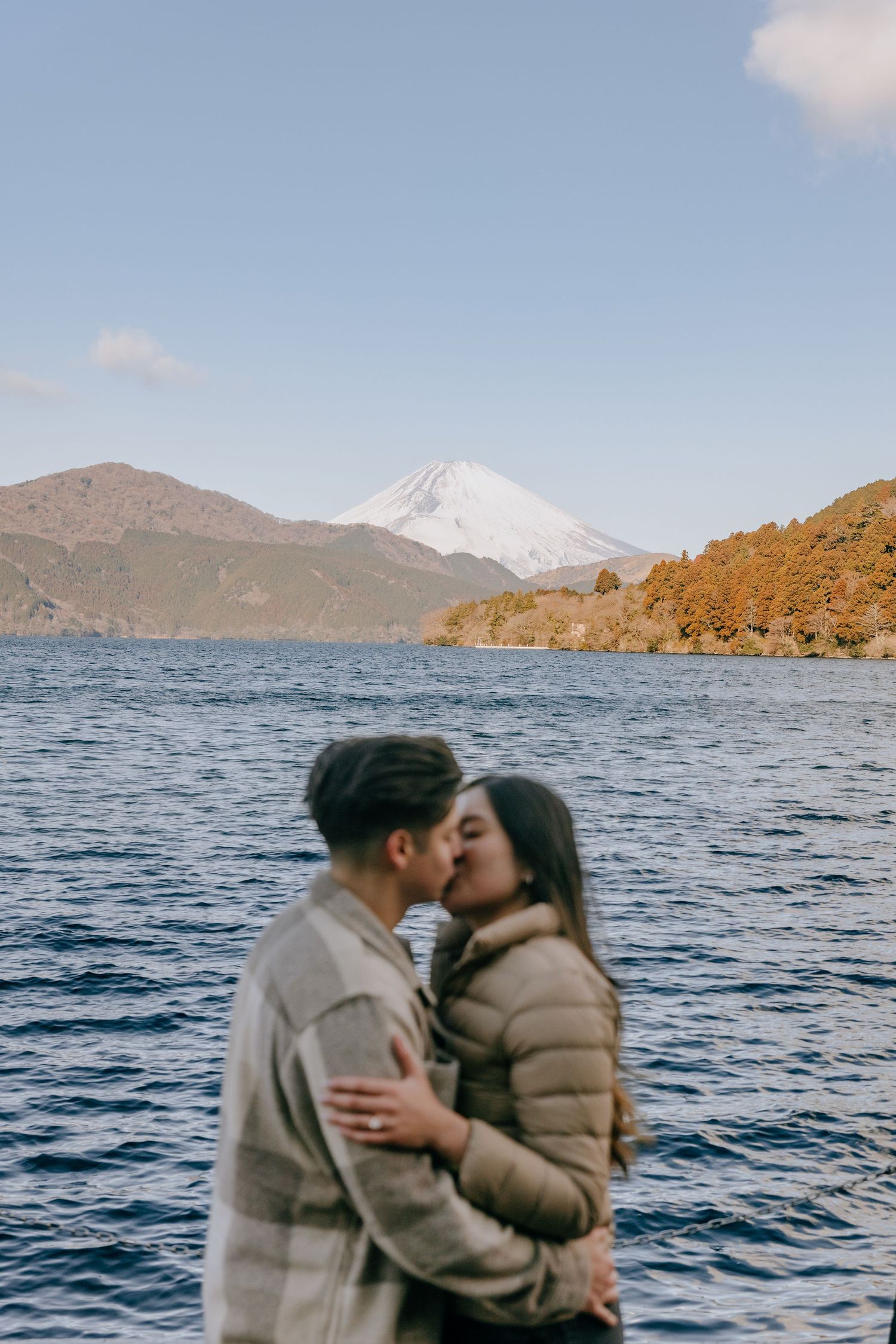 Couple engagement photo at Lake Ashi Hakone with Mount Fuji in the background