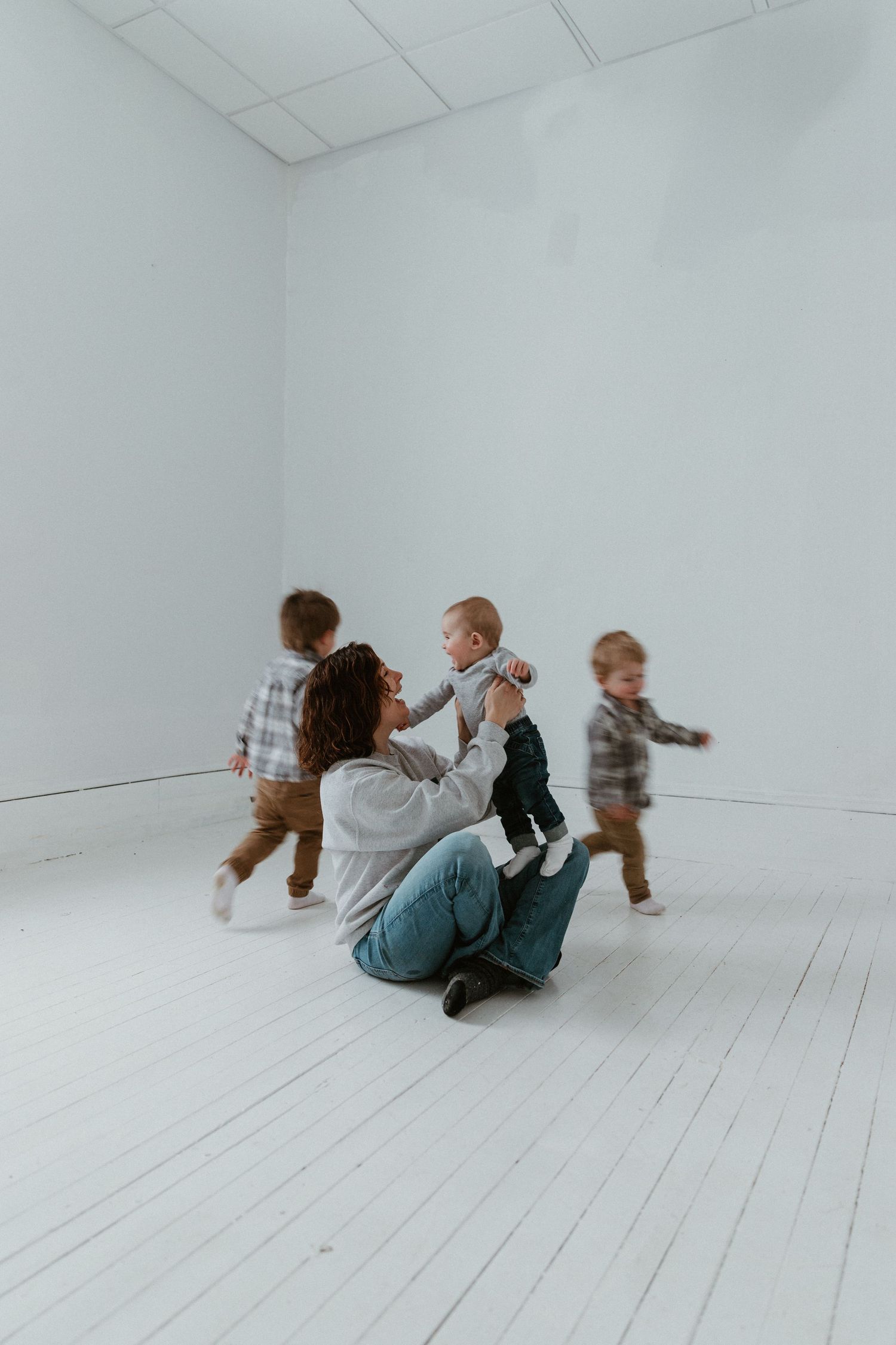 A sequence of playful movements captured in a bright white studio space.