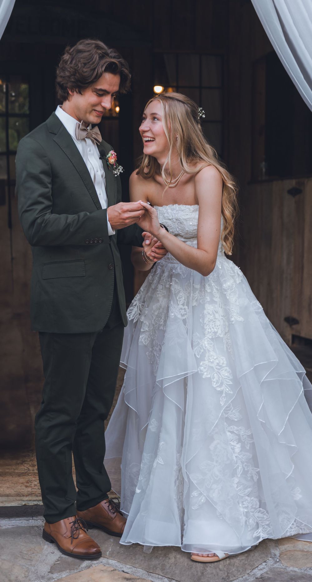 A bride and groom share an intimate moment dancing together during their wedding celebration.