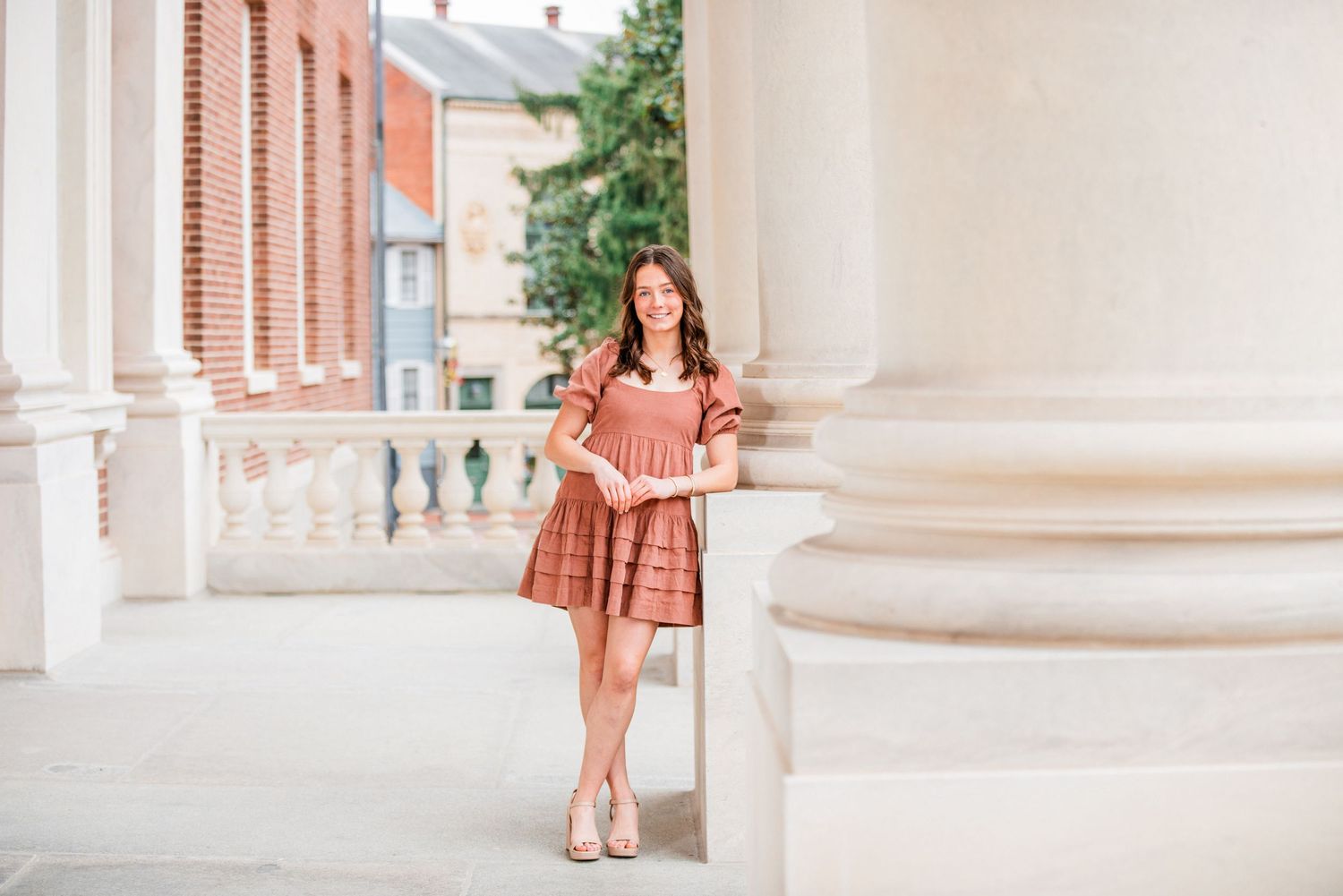 This senior is enjoying the Annapolis Capitol building for her memorable senior portraits!