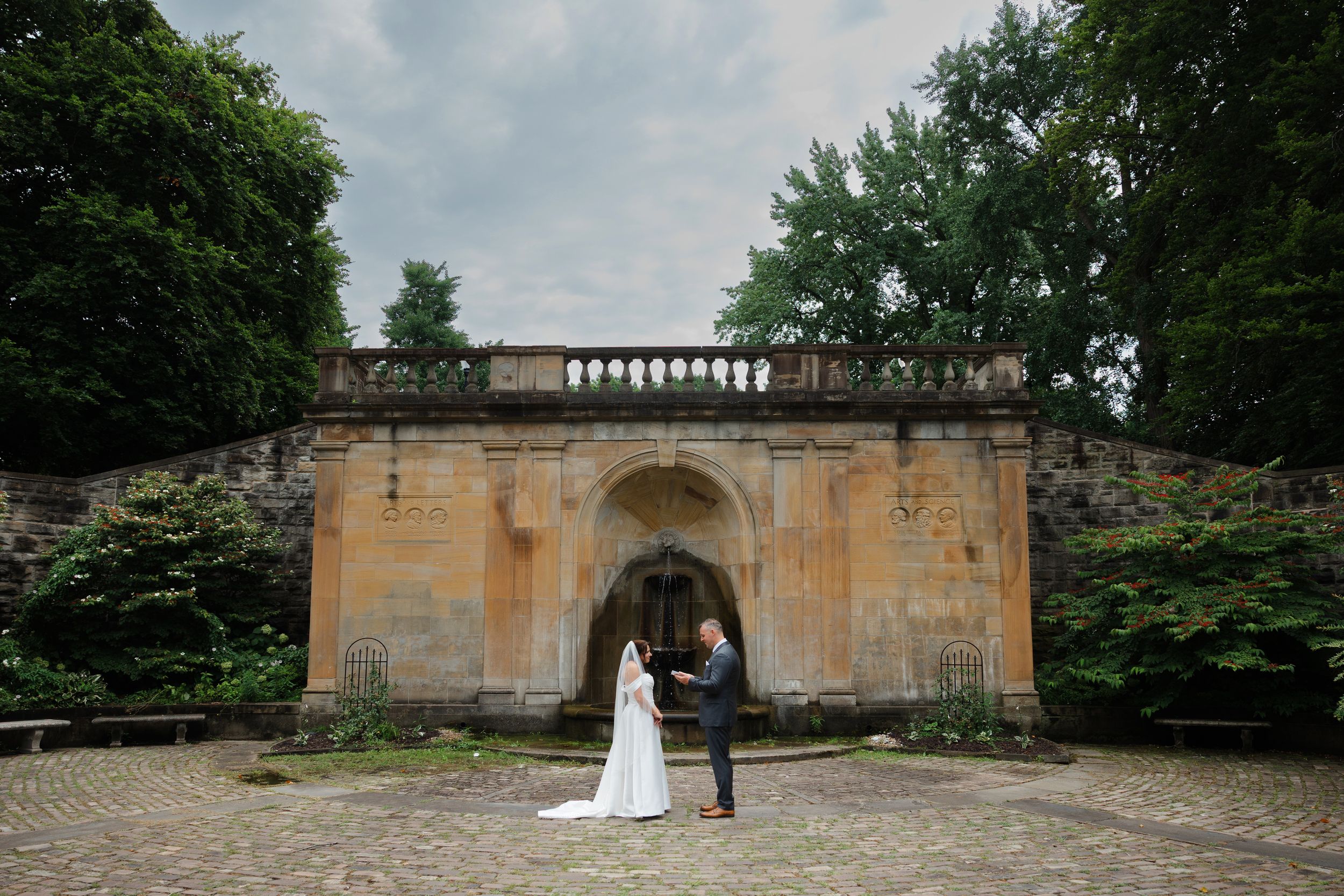 Bride and groom exchanging vows at Italian Cultural Gardens in Cleveland, Ohio.
