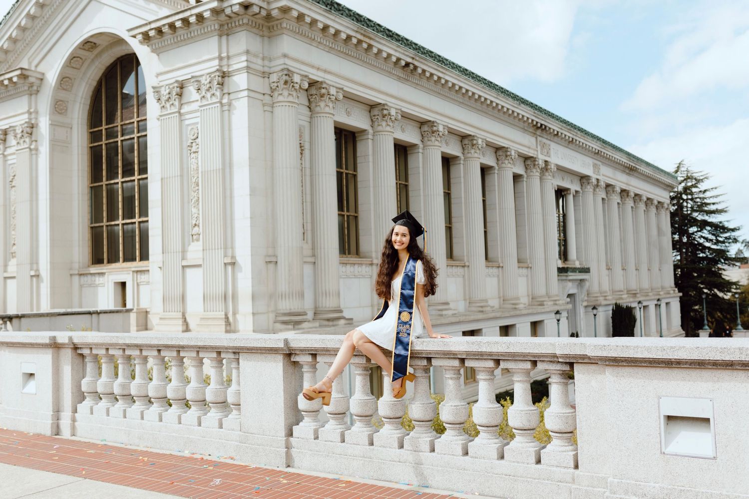 A series of architectural photos showing white neoclassical columns and balustrades at a grand historic building.