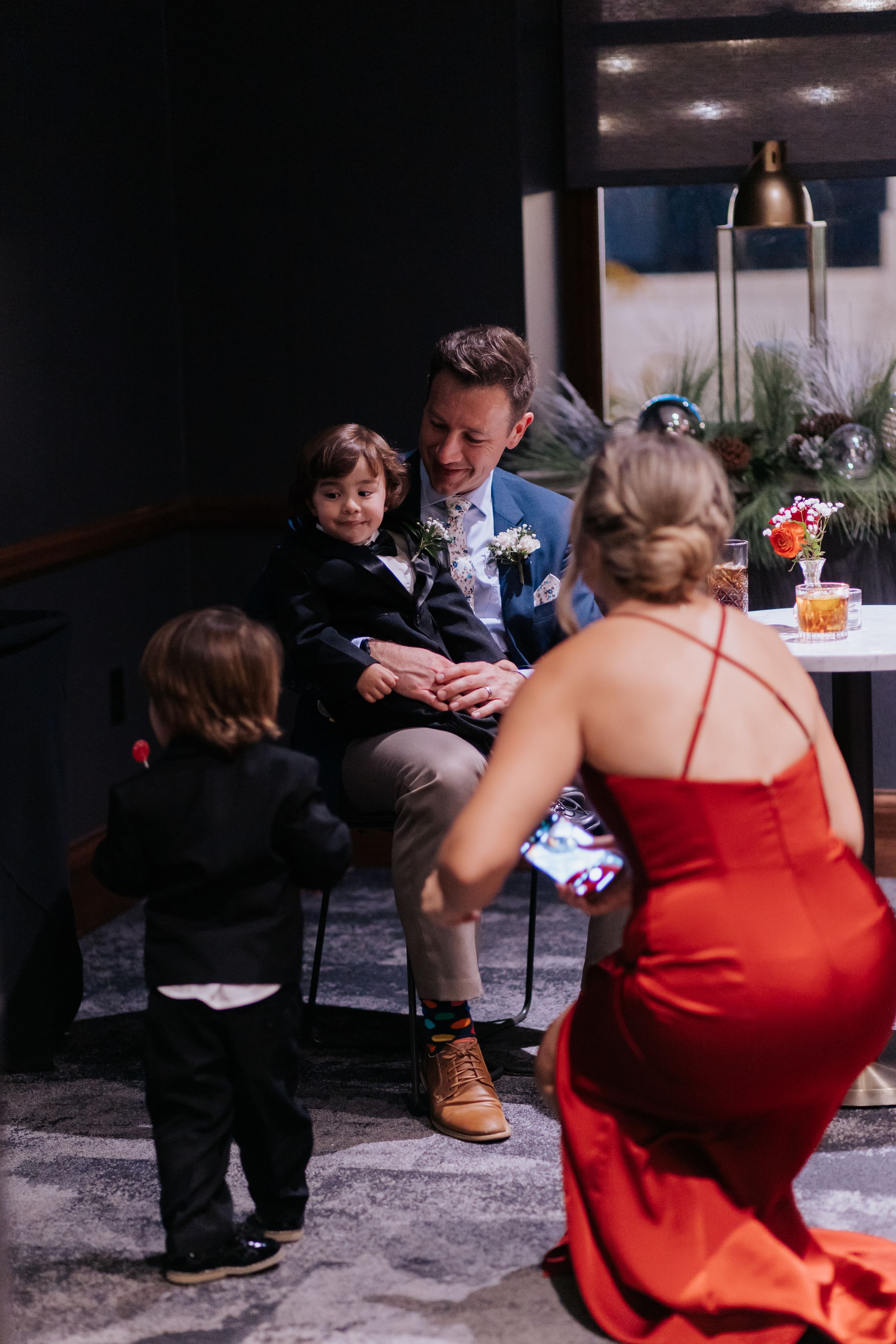 A sequence of candid moments showing a young child and adults interacting during what appears to be a wedding reception.