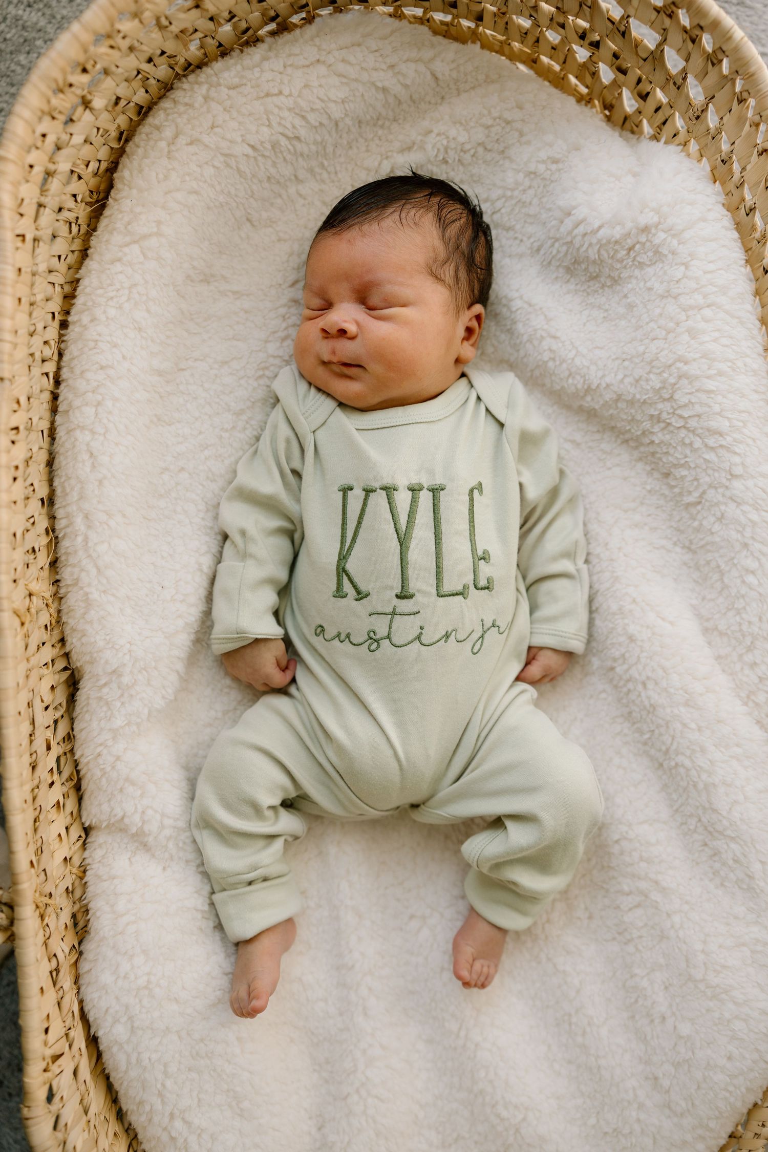 Mother holding her newborn baby during a lifestyle newborn session.