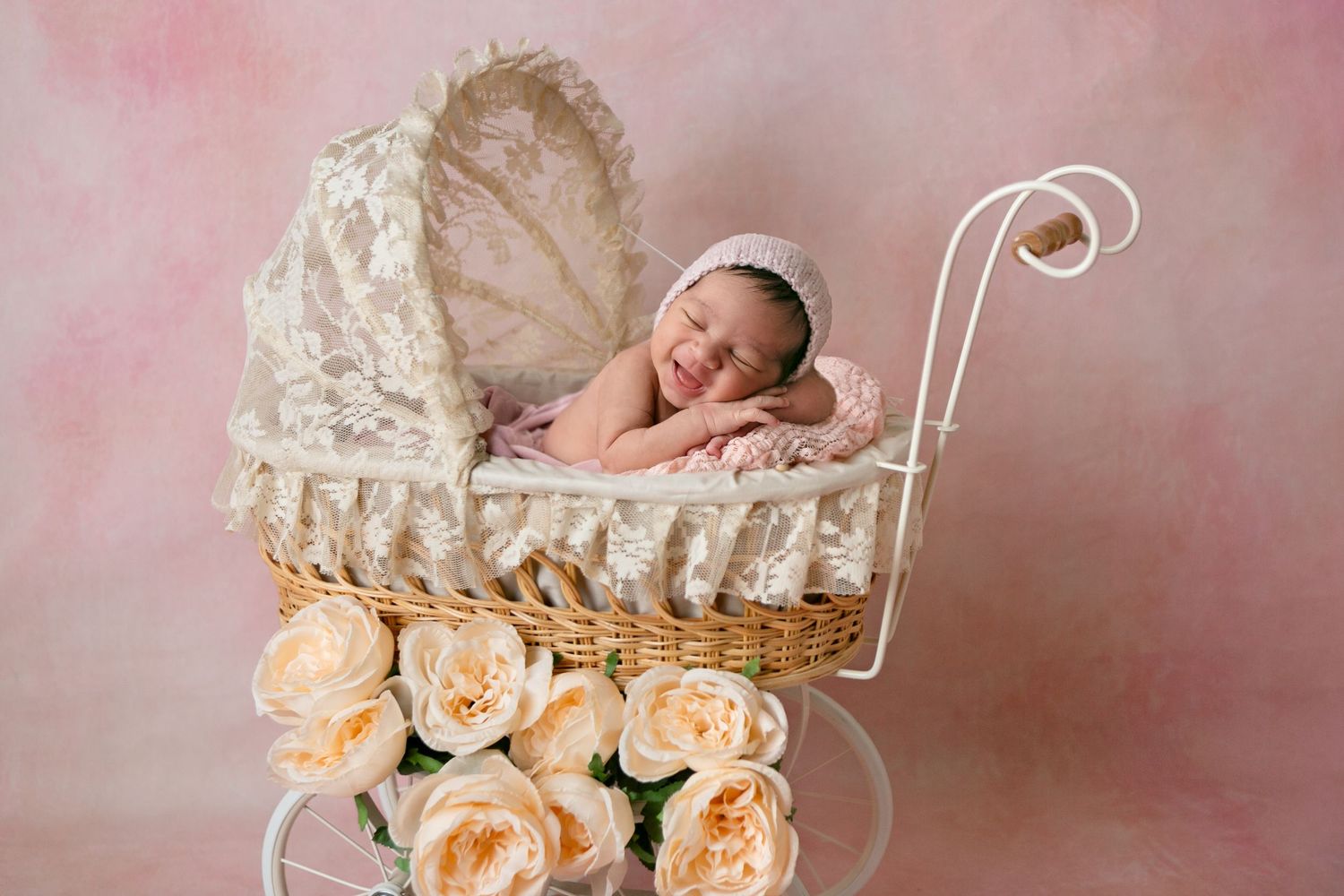 Vintage-style baby carriage with smiling baby, Orlando Newborn Photography, Sanford Newborn Photography, How to put your newborn to sleep