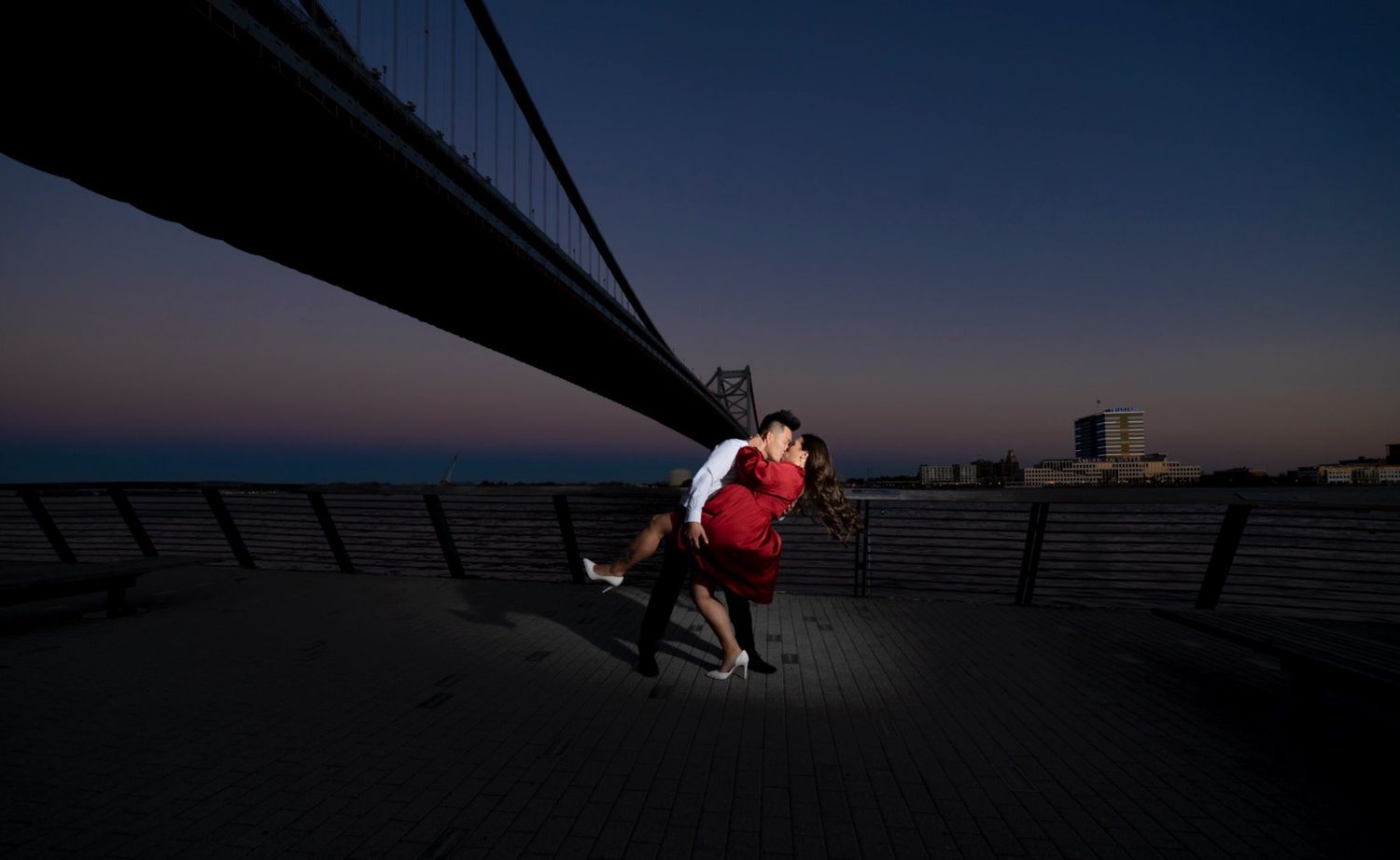 Dramatic night engagement portrait photographed with the Sony A7iii using off camera flash with Sigma 14-24 2.8