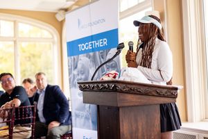 Keynote speaker at corporate event photographed by Kade Joy.