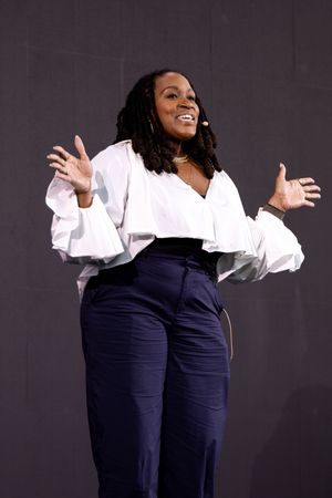 Event leader speaks at gathering photographed by queer event photographer Kade Joy.