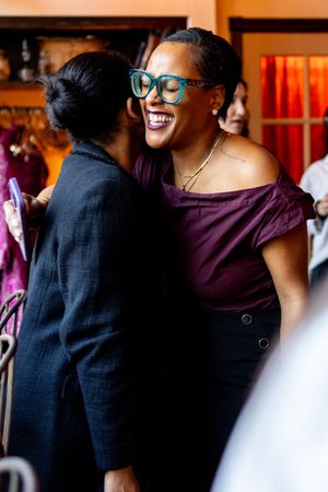 Photo of queer joy at a nonprofit event taken by event photographer Kade Joy..