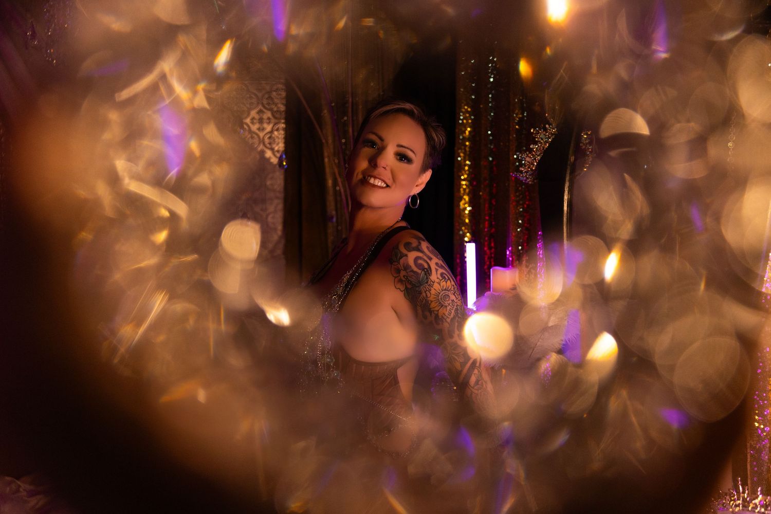 blonde short hair woman in the Glitz and glam set. crystals colored lights crowns sequins