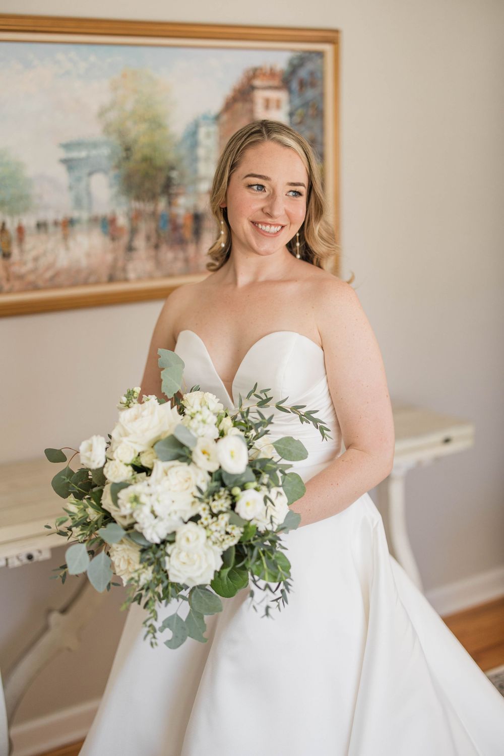 Alex holding her bouquet from Purple Iris in her Anne Barge wedding dress prior to her wedding