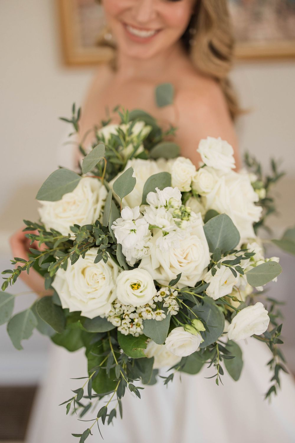 Alex holding her bouquet from Purple Iris in her Anne Barge wedding dress prior to her wedding