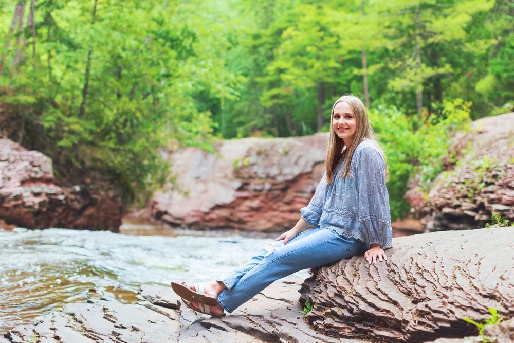 A series of outdoor photos showing someone sitting on rocks by a stream in a lush green forest setting.