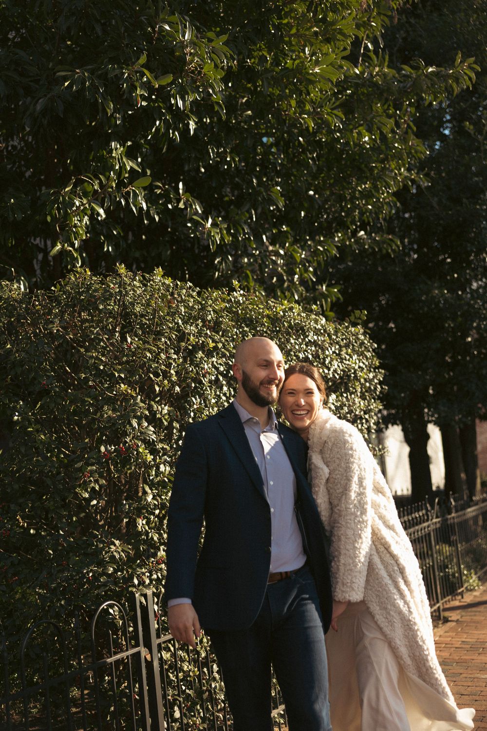 Romantic outdoor portraits along an ivy-covered garden path.