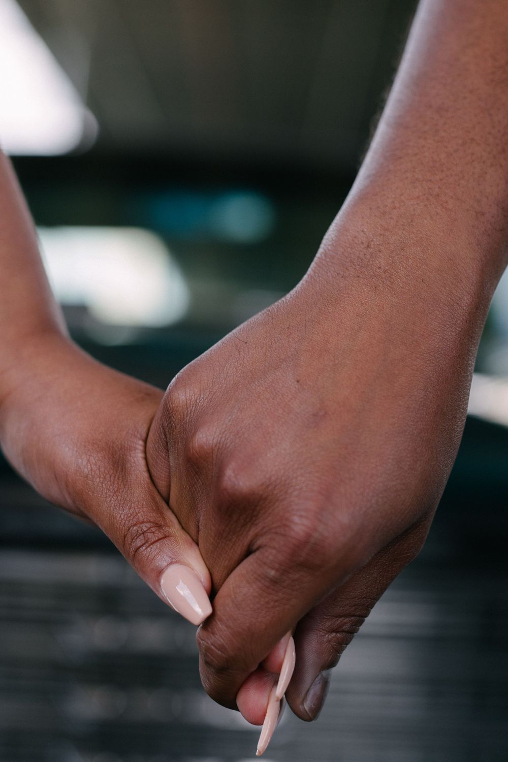 Close-up shot of hands opening a cigarette pack showing sequential movement across multiple frames.