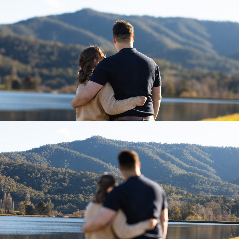 Couple embracing while gazing at a scenic mountain lake landscape during golden hour.