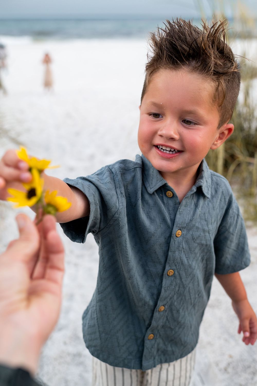Best beaches for families to visit in Destin Florida. Children playing with flowers at sunset for family photographer.