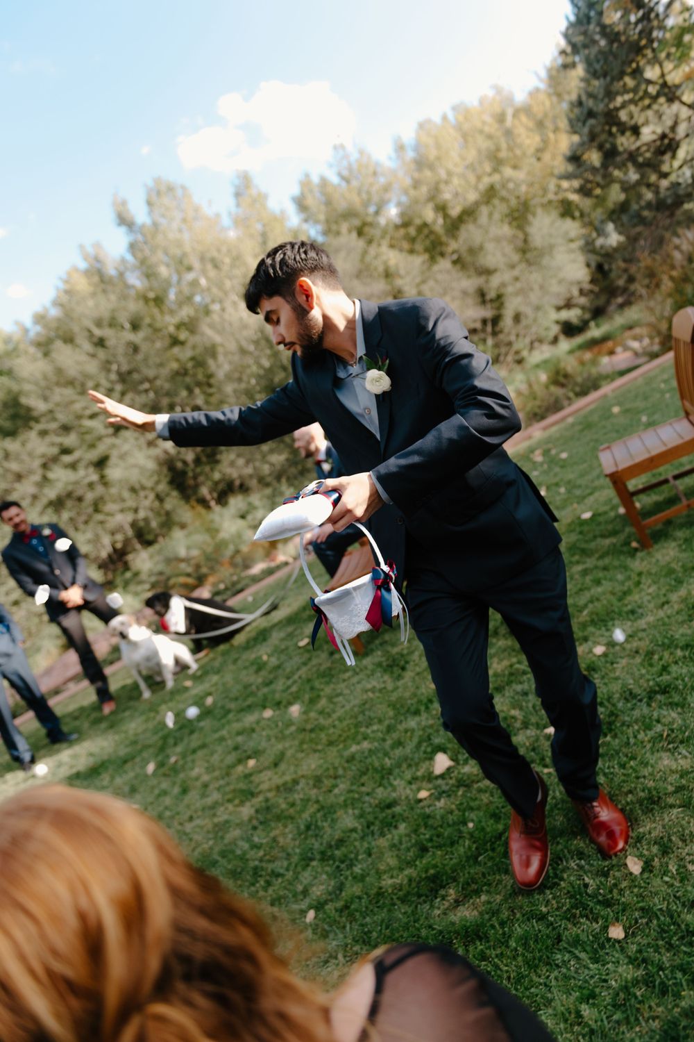 A sequence of images showing a person in a suit performing karate-like kicks on a grassy outdoor area.