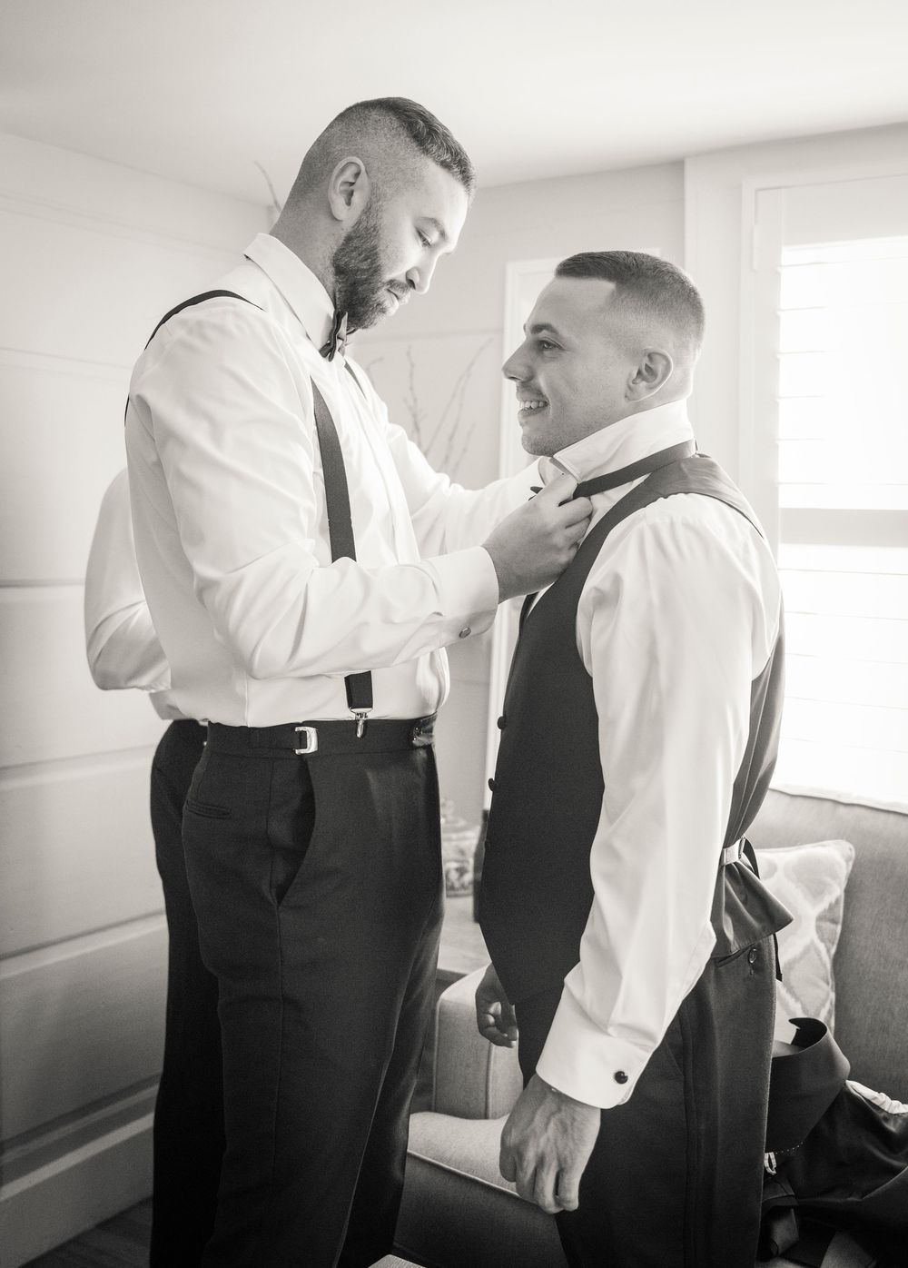 Black and white photos of formal attire preparation before the ceremony.