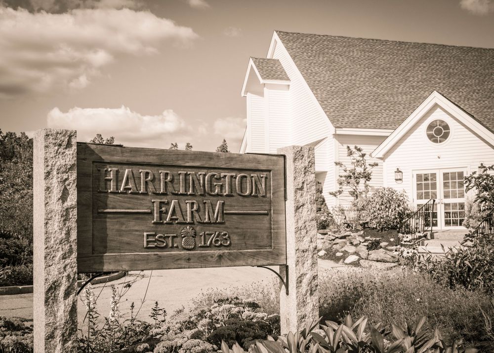 Panoramic black and white view of Harrington Farm wedding venue exterior.
