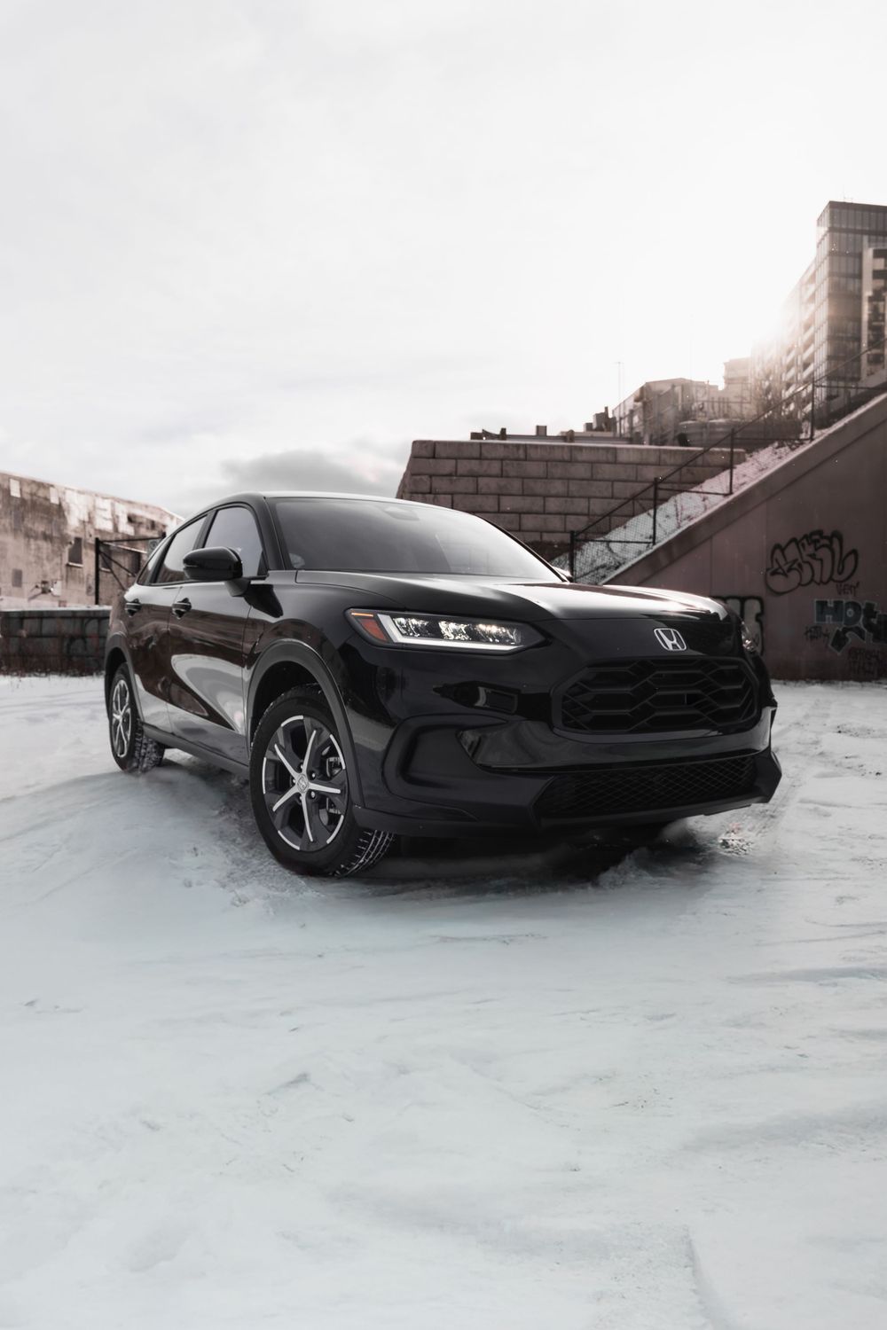 Front view of black Honda HR-V SUV in winter urban setting. Mtlshutter photography