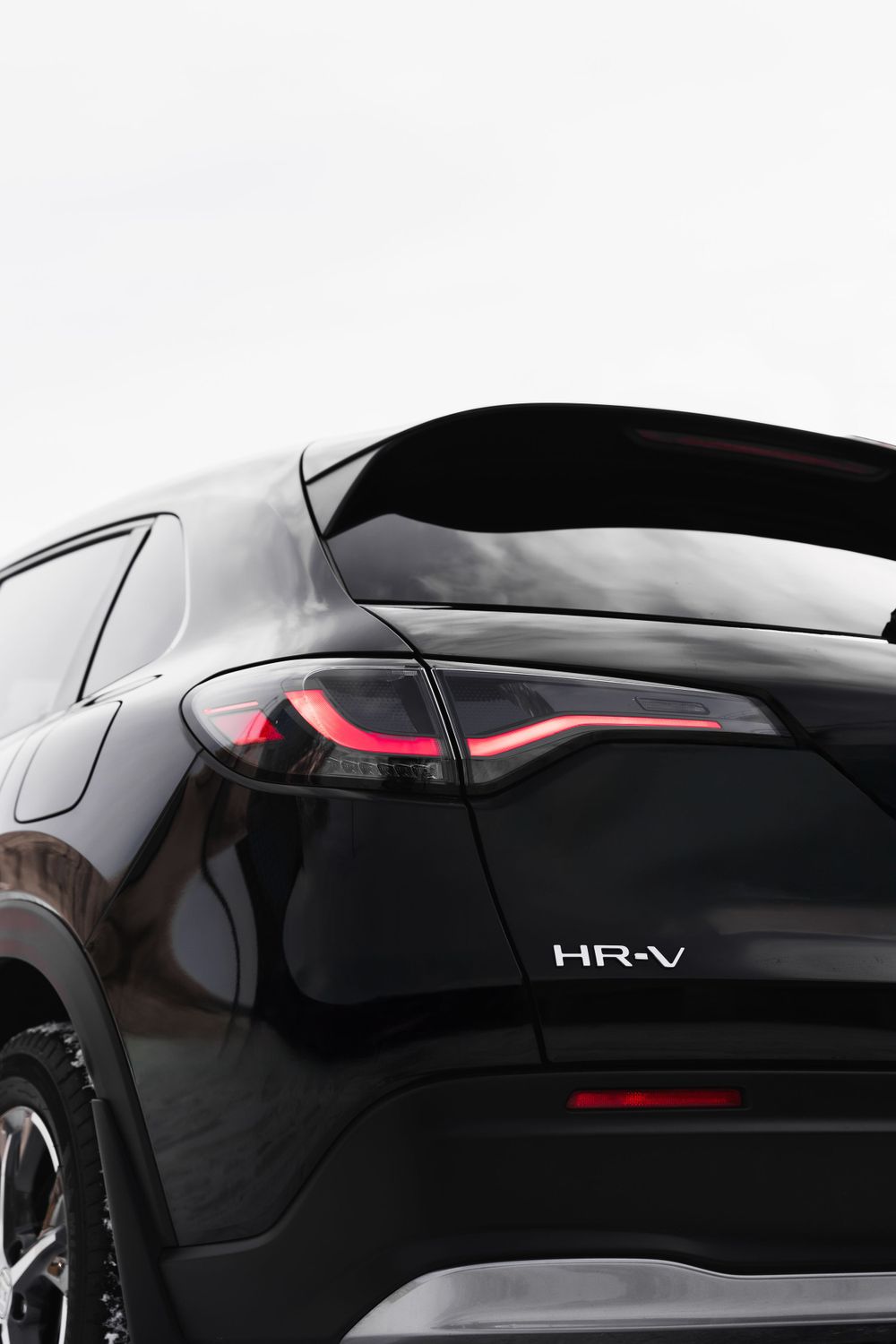 Sleek rear quarter view of black Honda HR-V showing modern taillight design. Mtlshutter photography
