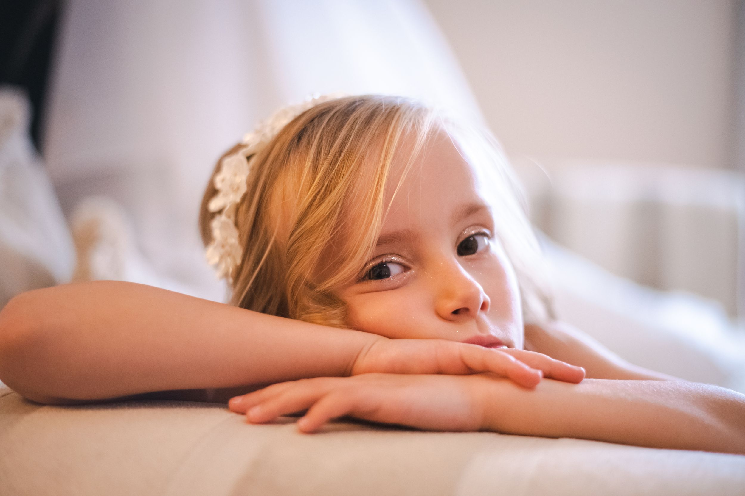 A resting figure in soft lighting creates a dreamy portrait.