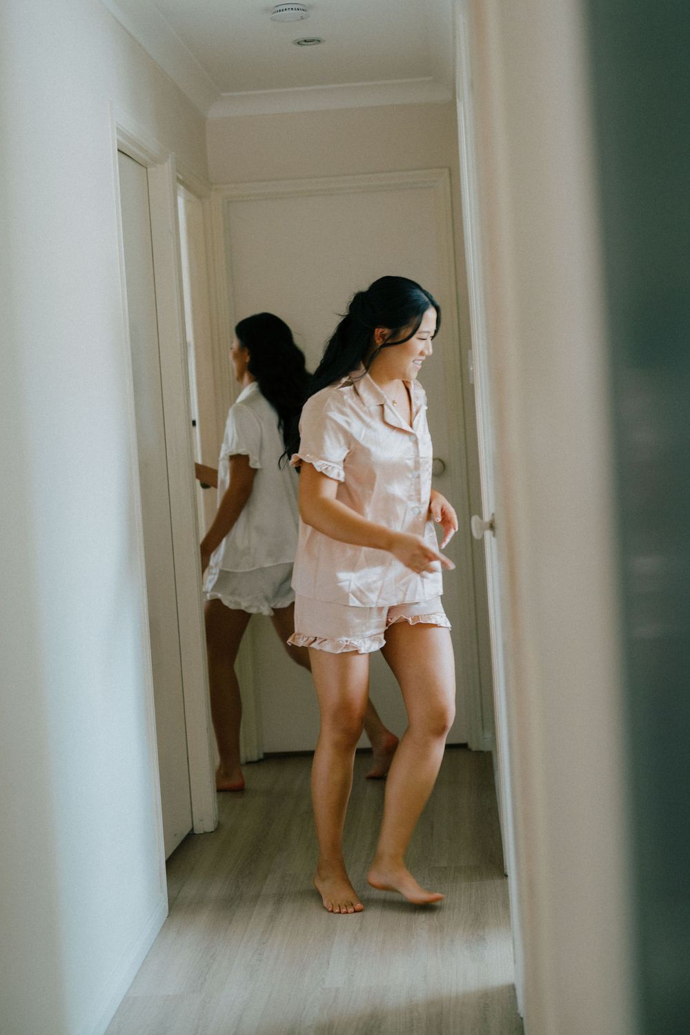 .	“Candid moments of the bride getting ready with her bridesmaids at The Refinery, photographed naturally.”