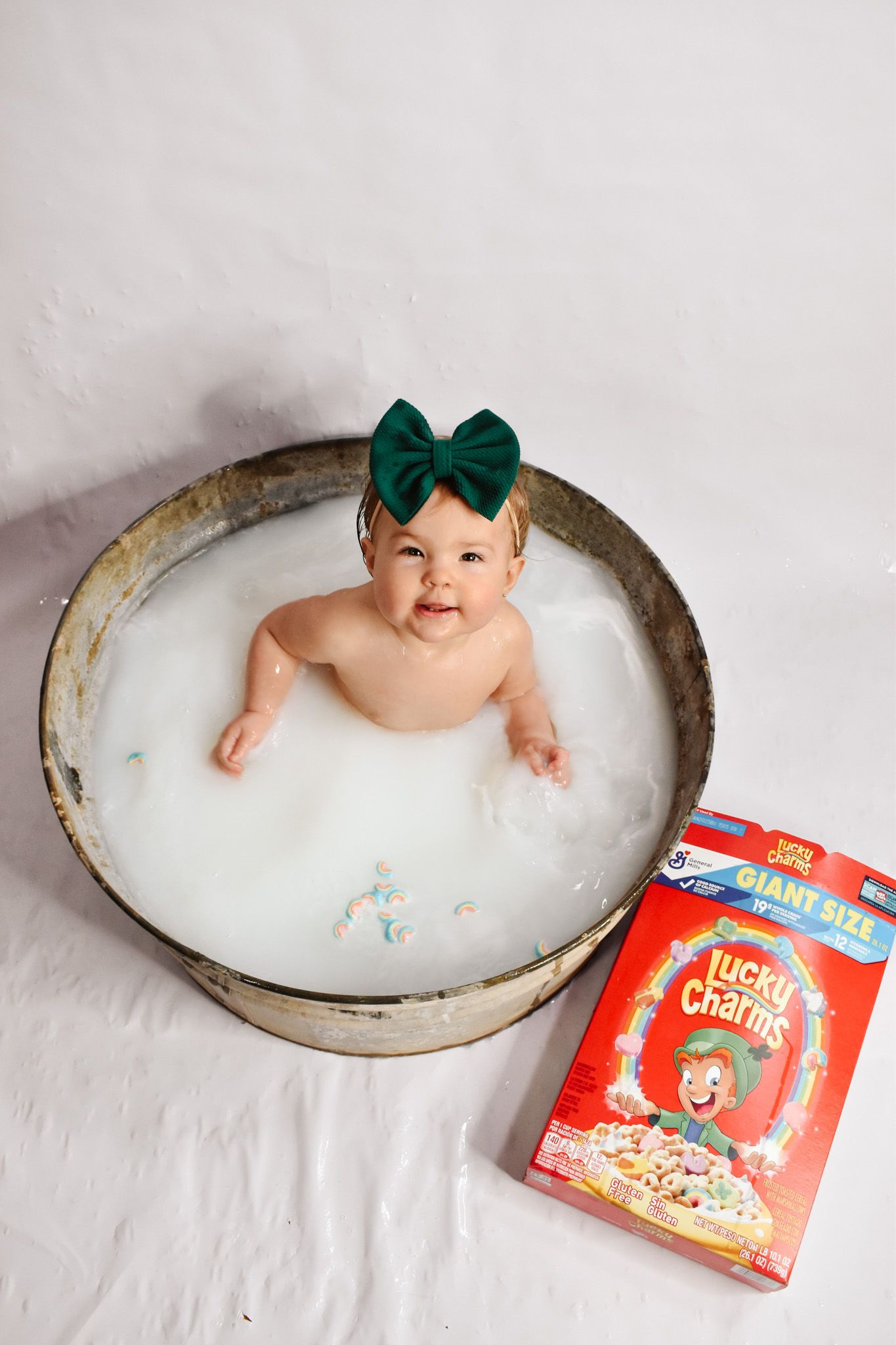 A themed photoshoot setup with milk bath and cereal box props.