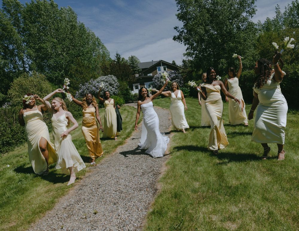 A sequence of photos showing wedding guests enjoying themselves in a playful conga line on a grassy path outdoors.