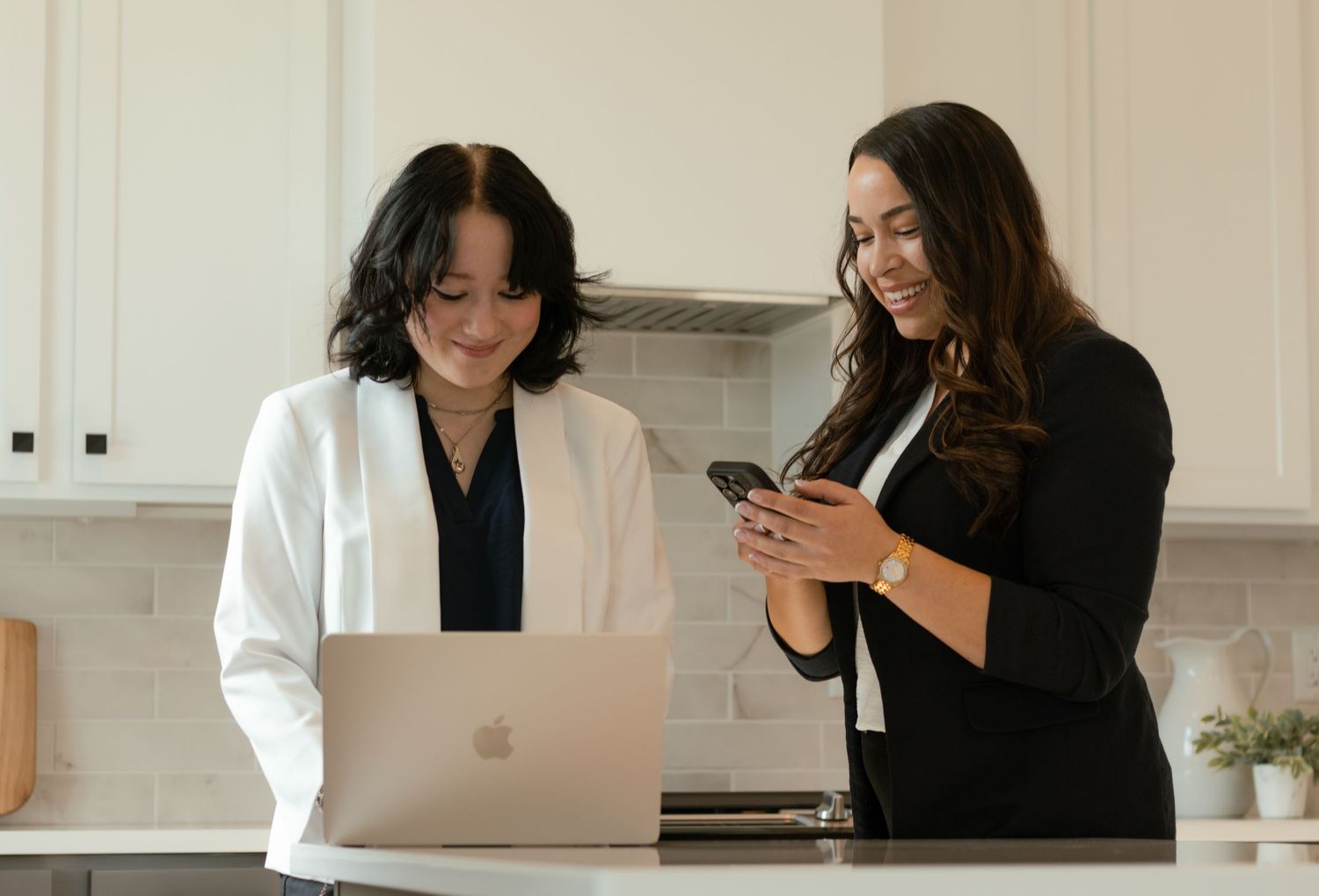 Branding photo of businesswomen working together during a lifestyle session in Tri-Cities WA kitchen