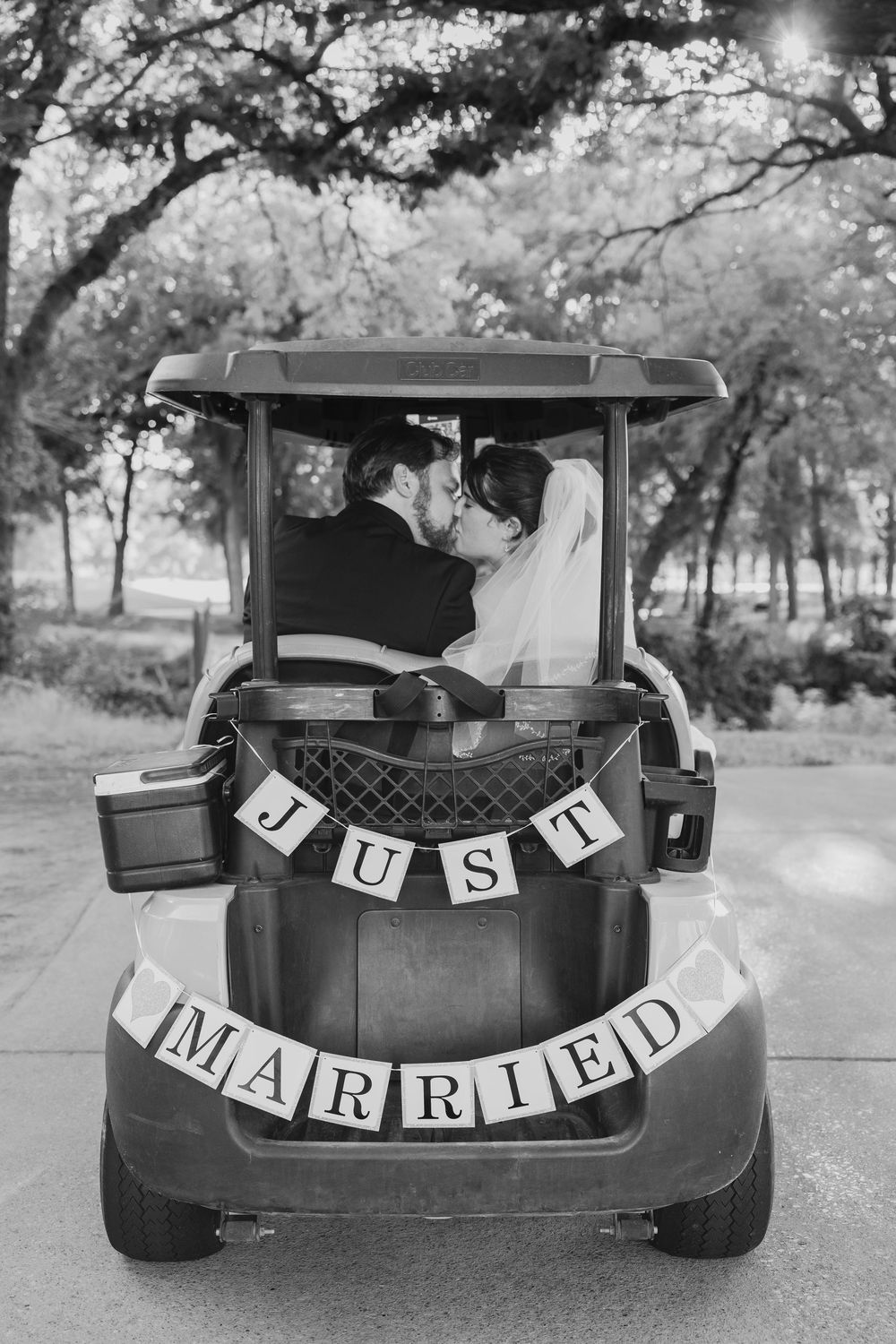 Wedding big day sky creek ranch Keller TX just married golf course summer wedding party photographer DFW country club bride groom kissing