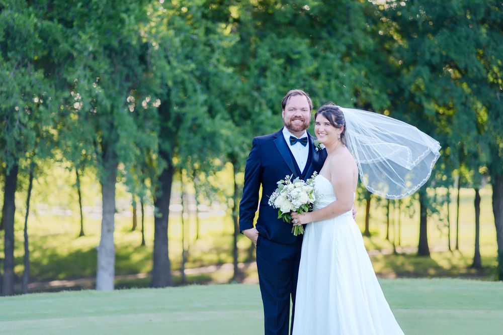 Wedding big day sky creek ranch Keller TX just married golf course summer wedding party photographer DFW country club bride groom kissing