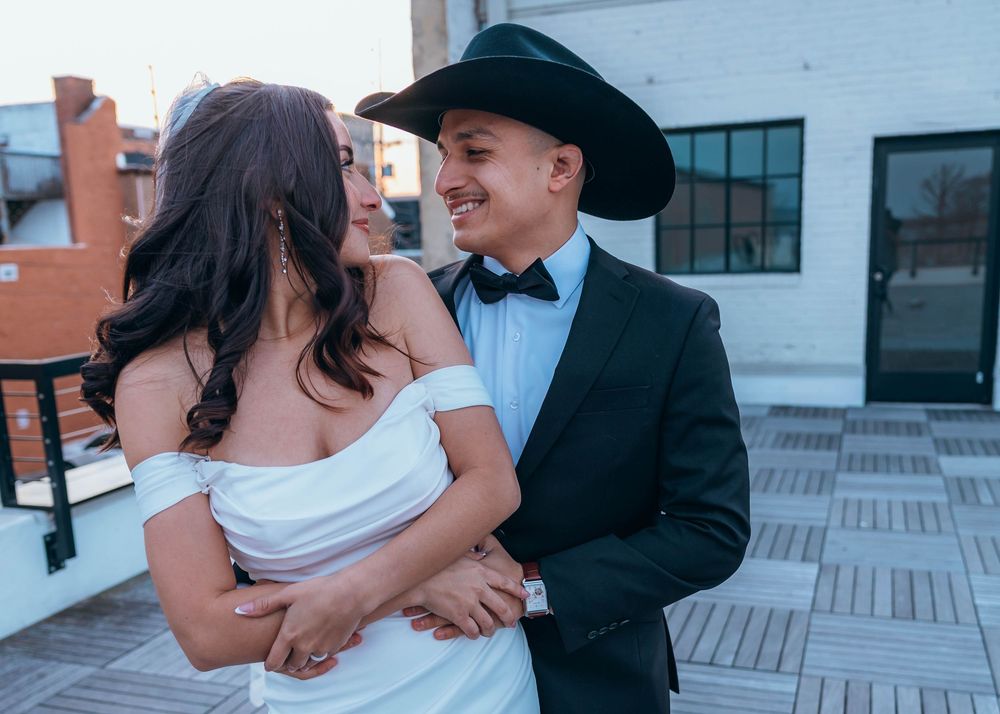A romantic moment captured on an urban rooftop during a wedding. North Carolina.