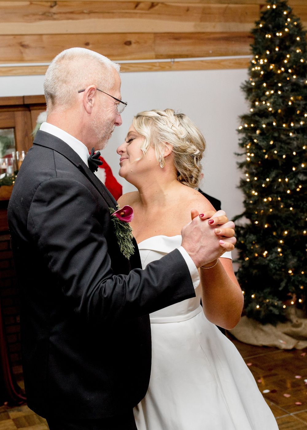 Bride and groom sharing a joyful moment during their wedding day in North Carolina.