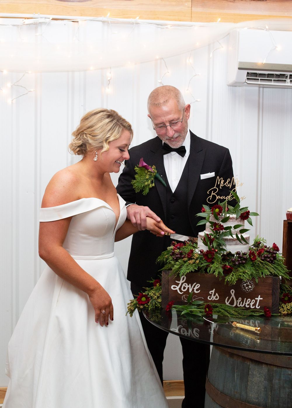 Bride and groom cutting their cake during their wedding day in North Carolina.