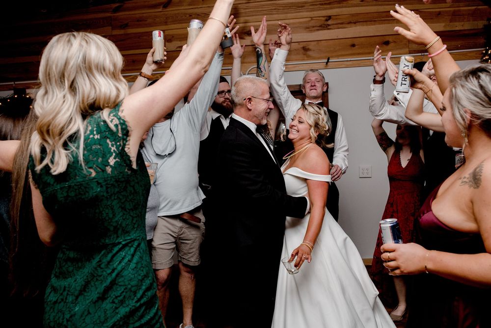 Bride and groom sharing a joyful moment during their reception in North Carolina.