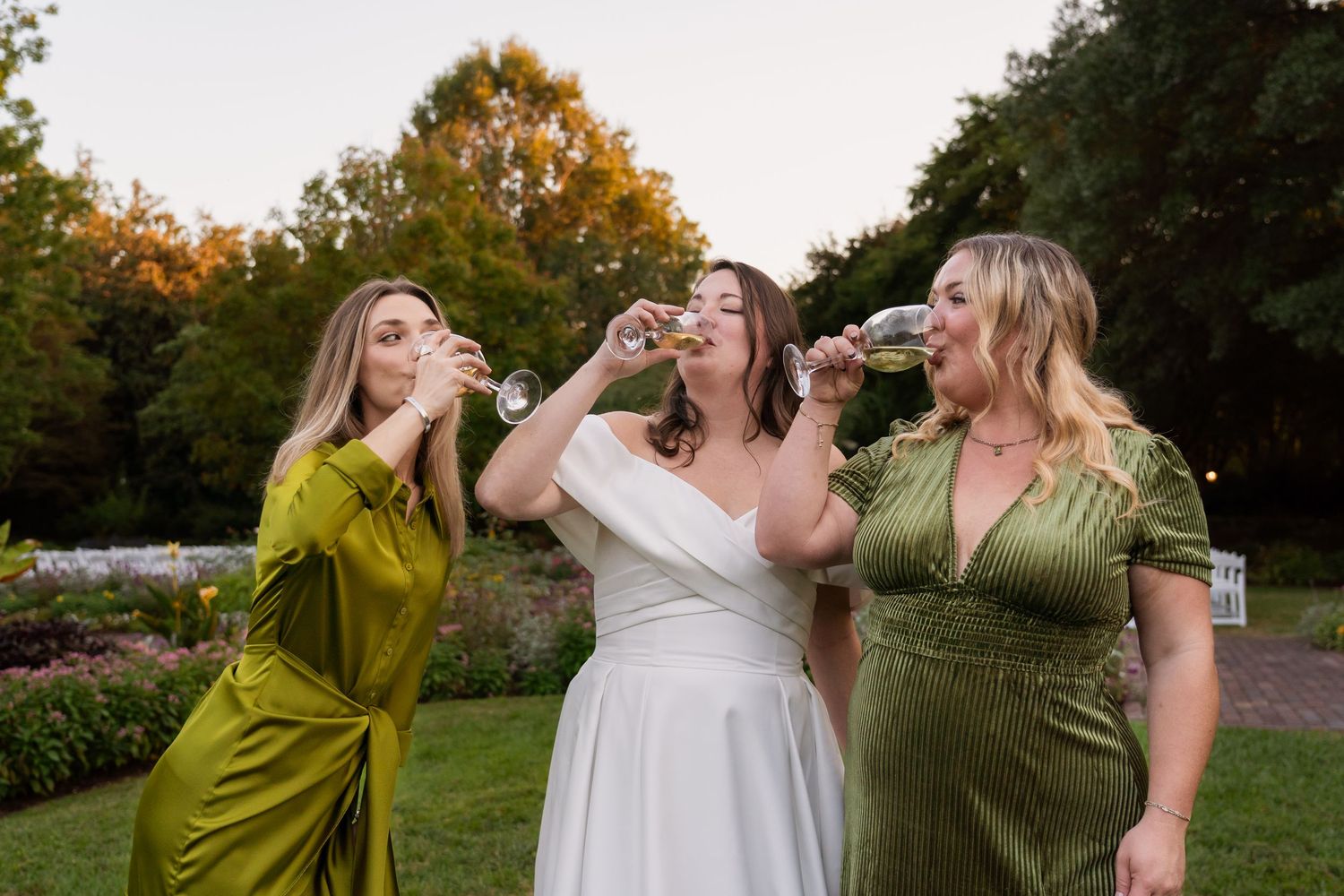 Bride making a cheers with her bridesmaids