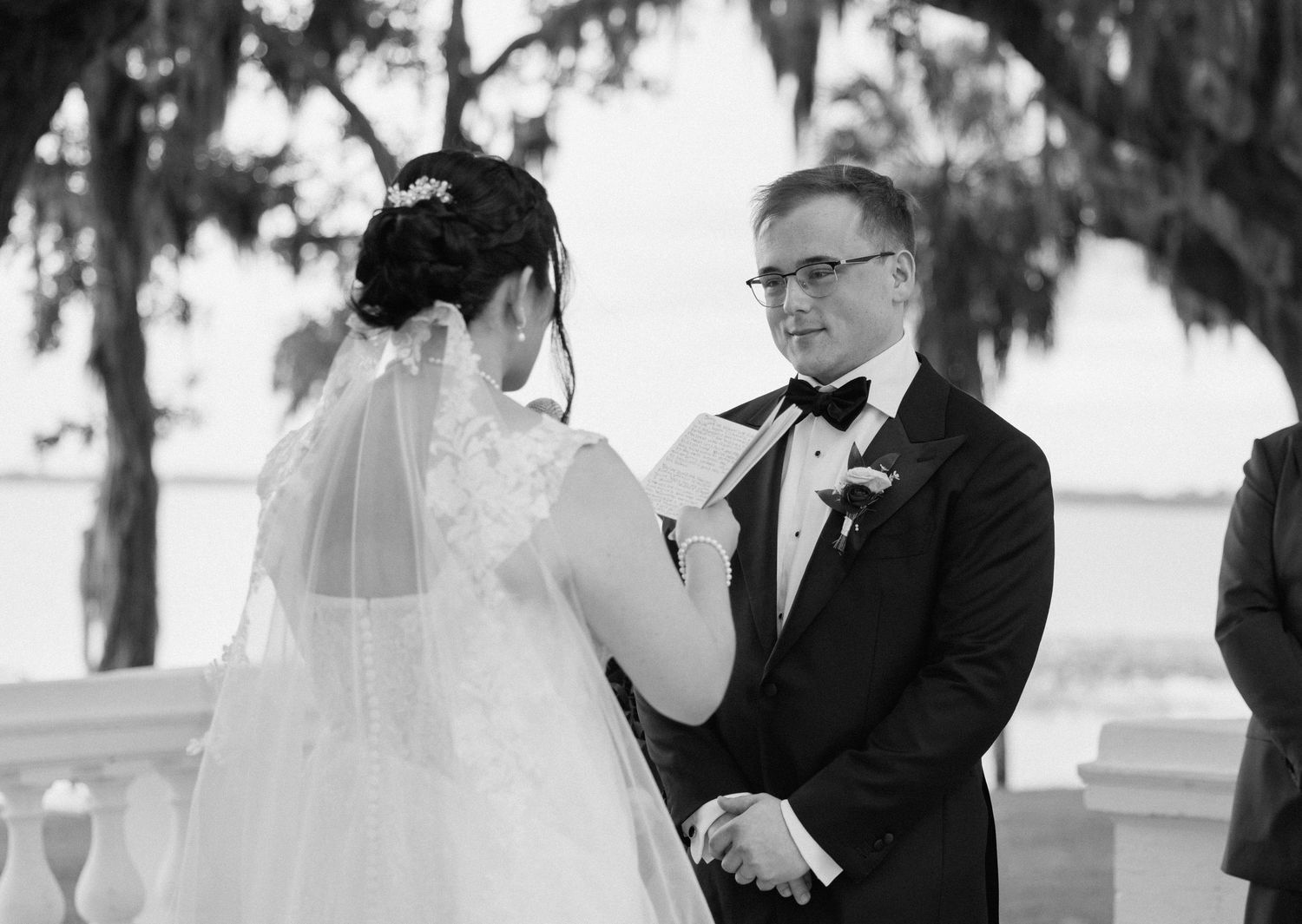 Black and white photo collage showing intimate wedding moments with couples embracing and dancing at an outdoor venue.