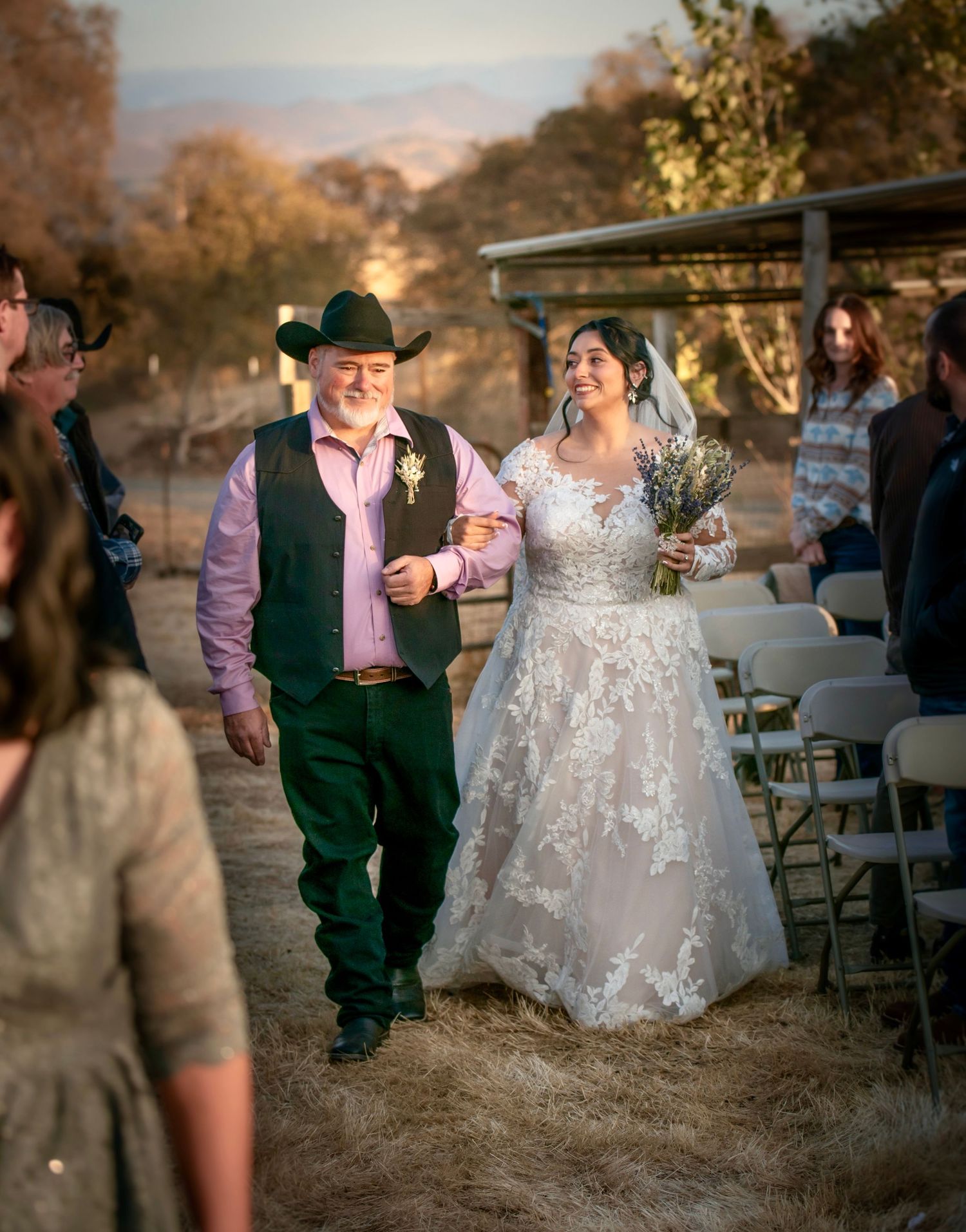 A bride and her father going down the aisle at a rustic country foothill wedding in la Grange, California