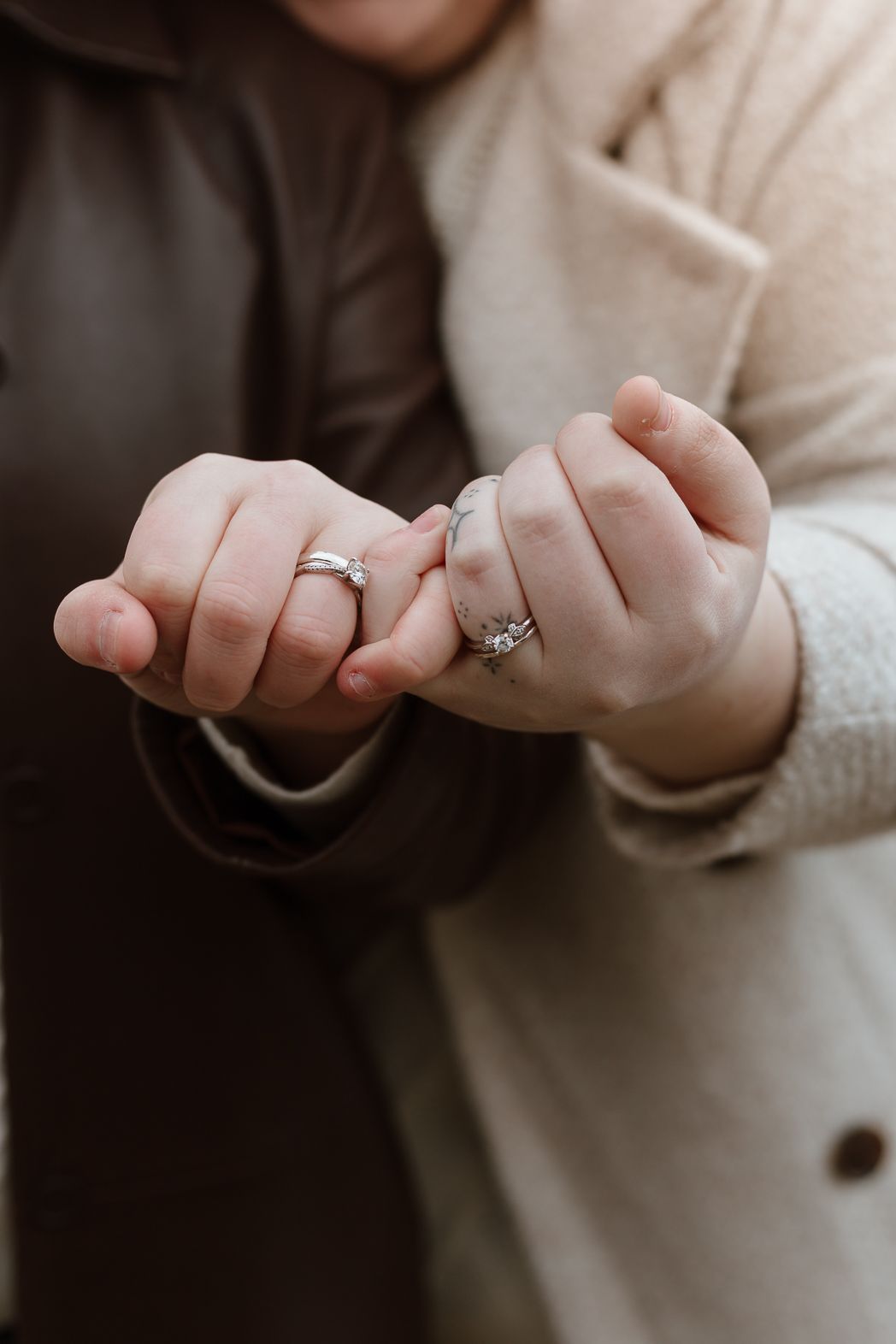 Close-up sequence showing hands and a sparkling engagement ring in soft lighting.