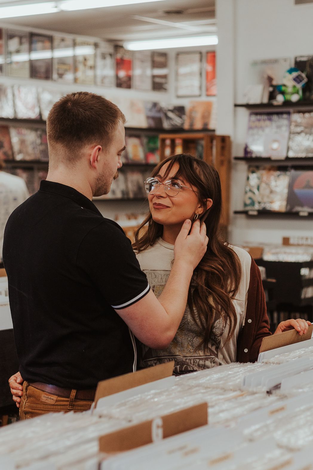 Romantic moment shared at a casual indoor cafe setting.