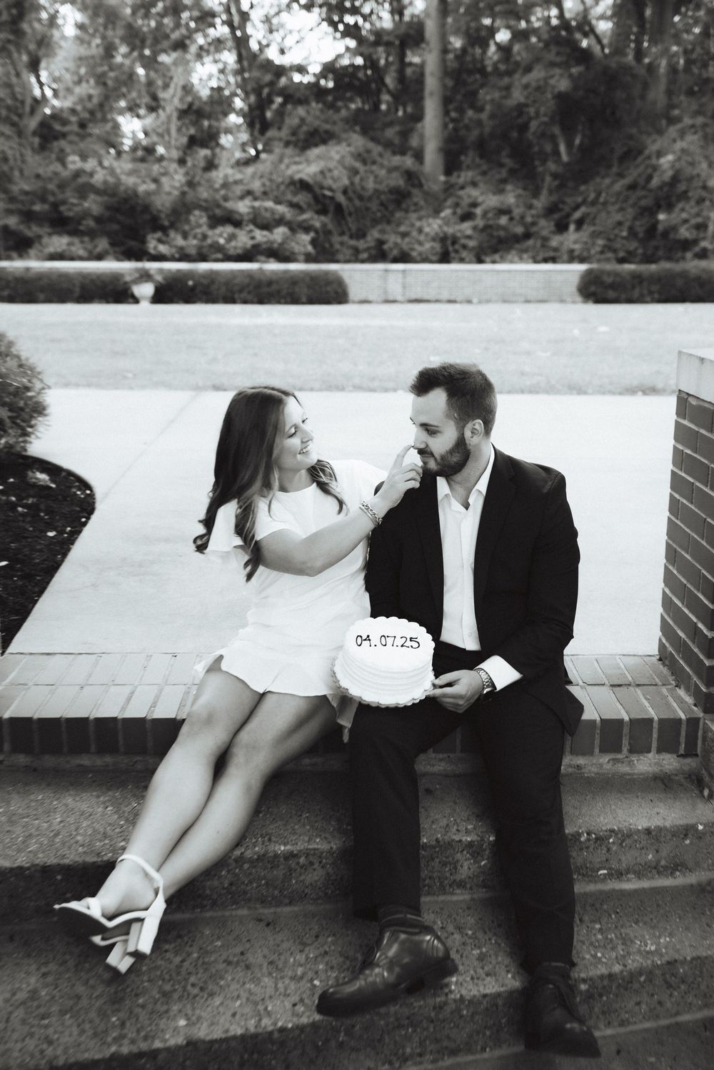 Vintage trendy couples session with a black and white photo series of a couple sitting casually on outdoor steps.