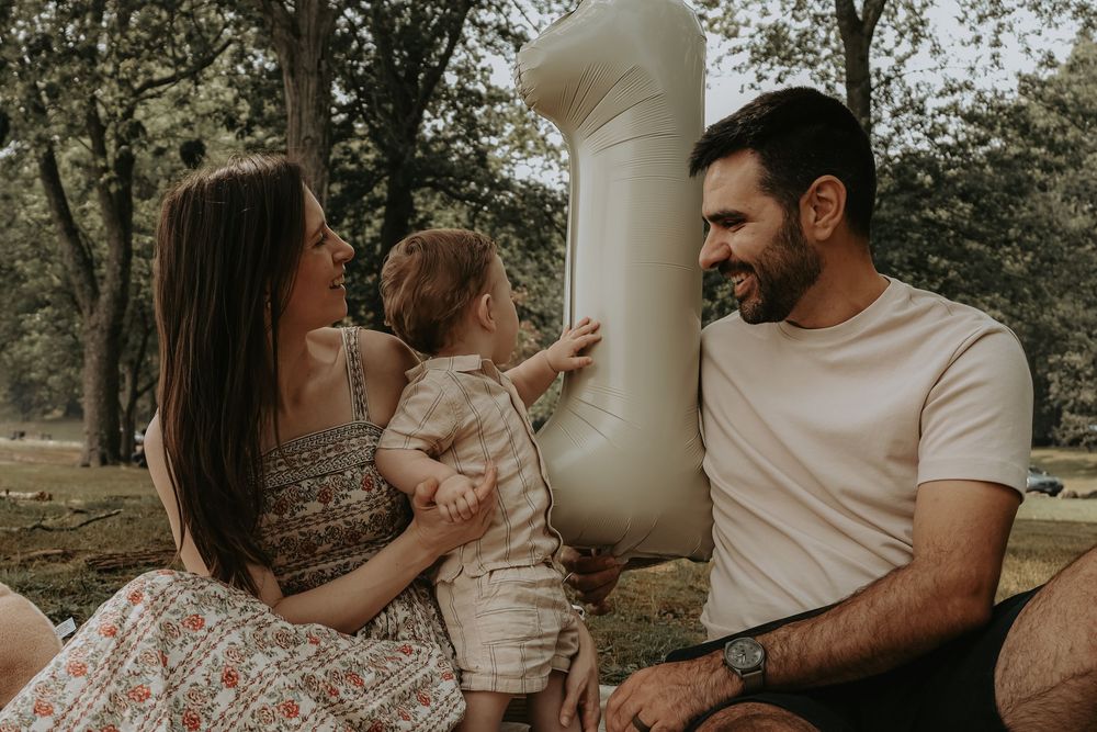 Intimate family moments shared in a warm outdoor setting with natural lighting.