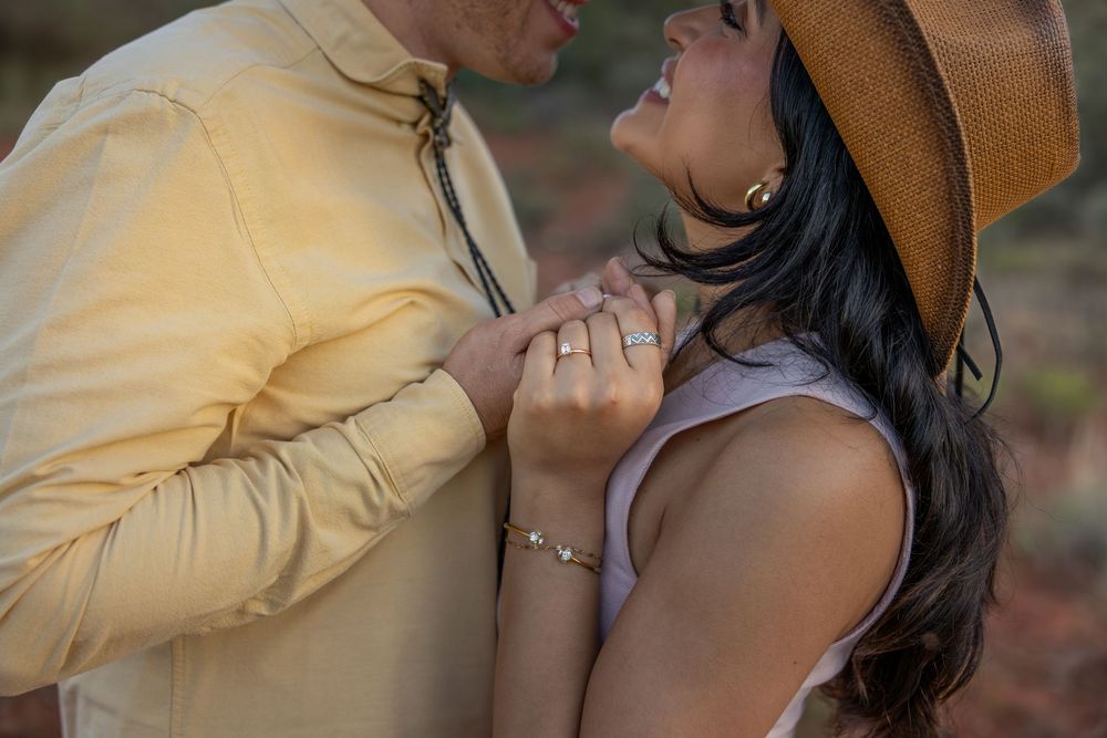 Close-up of couple nearly kissing with engagement ring visible in Sedona.
