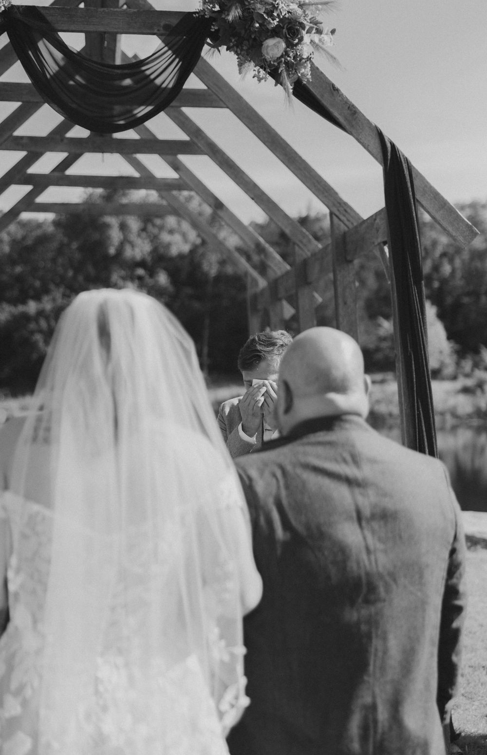 Three black and white vintage wedding photos showing a couple under an outdoor archway during a ceremony.